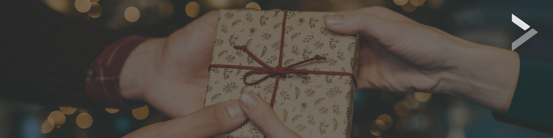 Blog Post Header image of two hands holding a gift