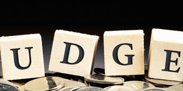 Scrabble pieces spelling the word "Budget" representing 2025 budget and what it means for HR Leaders