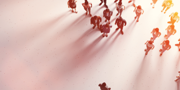 Bird’s-eye view of a large group of diverse people walking in different directions, symbolising a flexible and dynamic modern workforce.